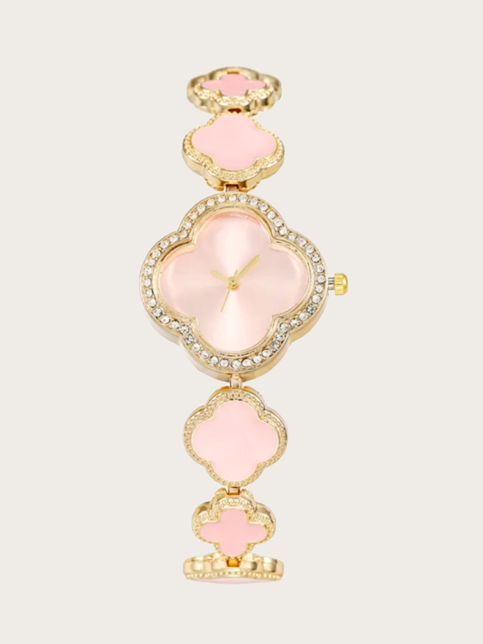 Pink Clover Watch Pink clover-shaped watch with gold-tone finish and adjustable bracelet.