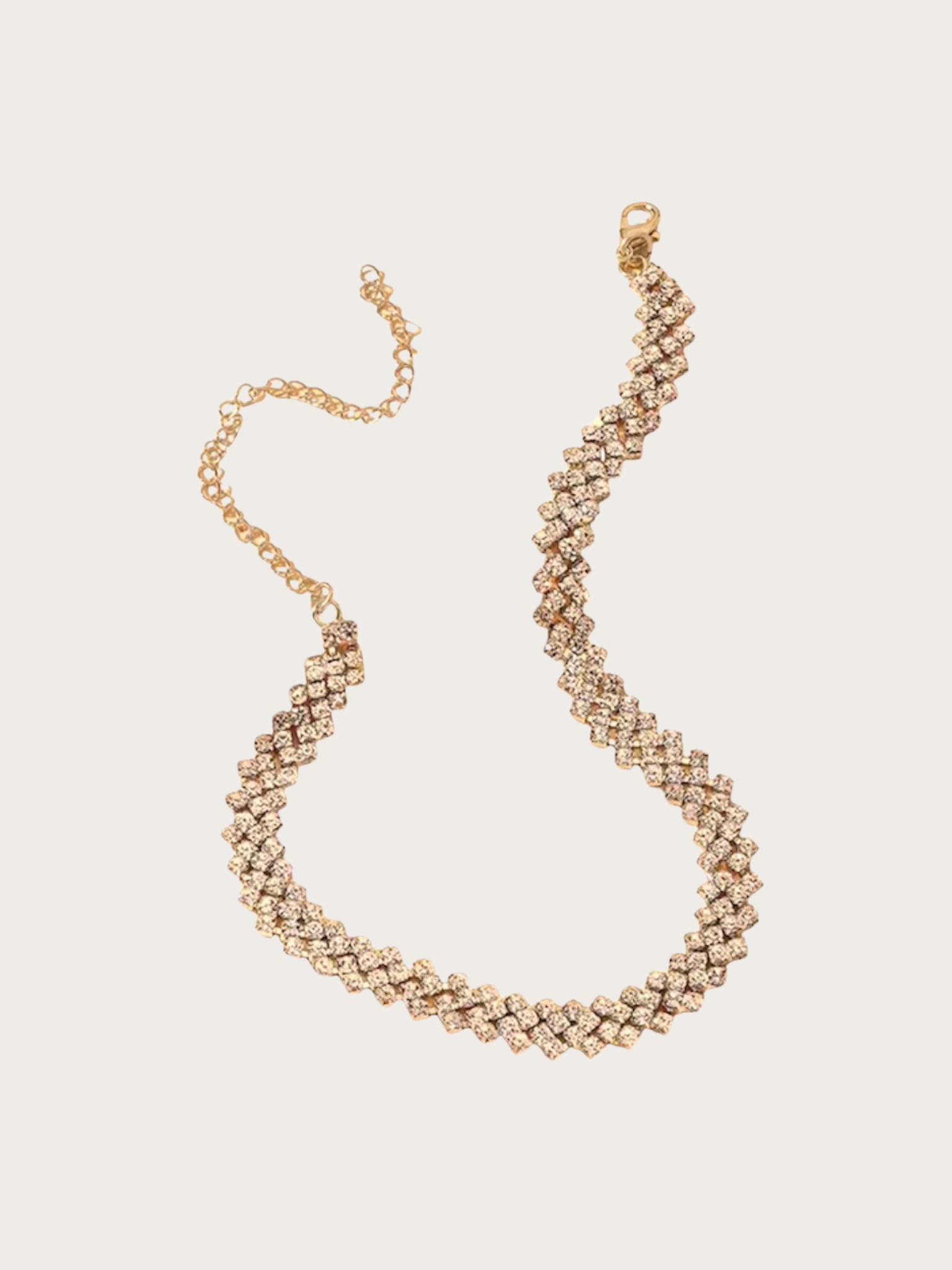 Maya Necklace gold Gold rhinestone necklace with zigzag crystal design.