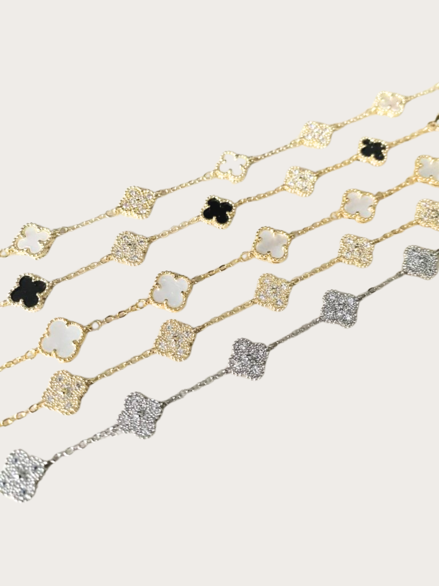 Rojin bracelet Gold and silver bracelet with clover charms in various colors