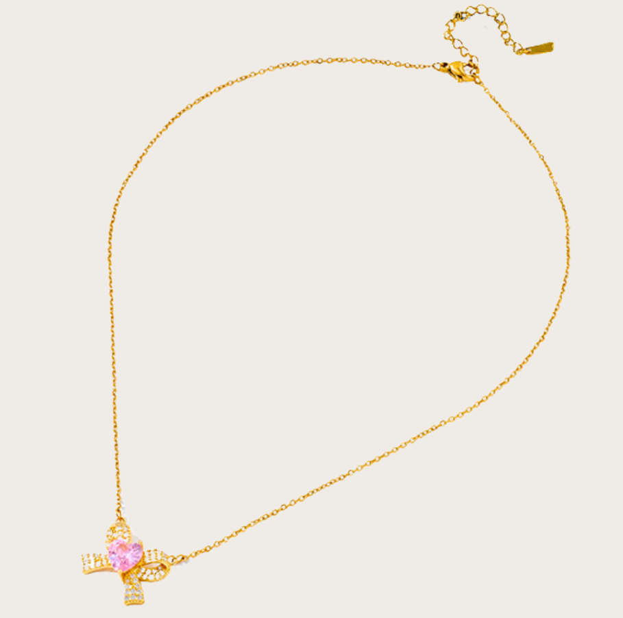 Elegant Nayla Bow Necklace in 18K gold-plated stainless steel with a zircon bow and pink heart.