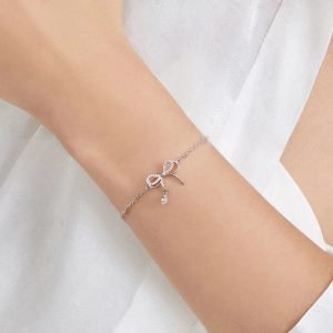 Shira Bow Bracelet in silver with sparkling rhinestones, adding a fairy tale charm to your look.